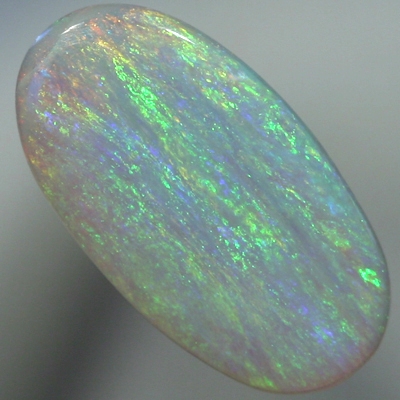 SOLID SEMI BLACK OPAL Iris pattern, green and orange over blue